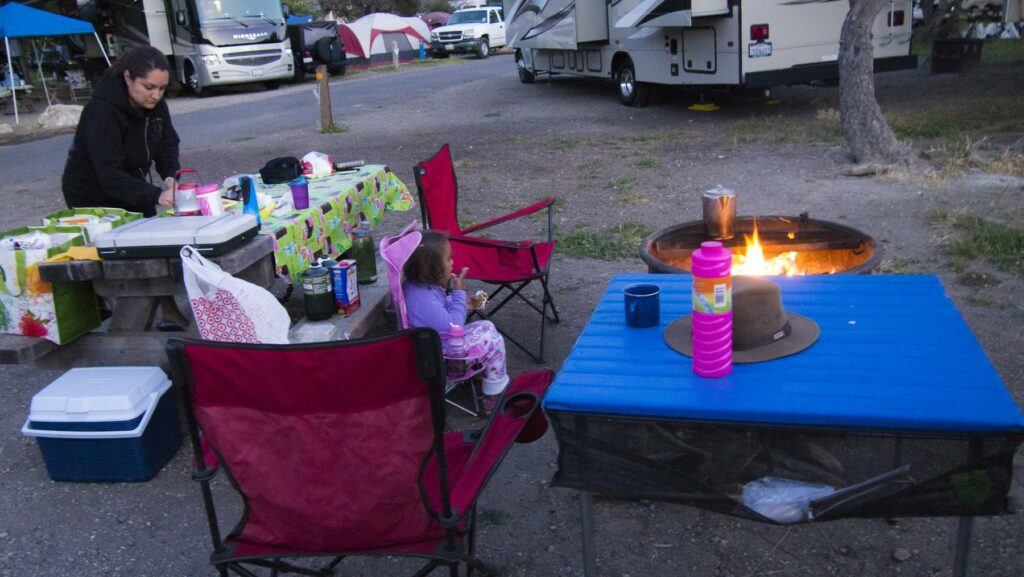 a woman sitting in a chair - File:Goleta Camping Trip (14349411685).jpg