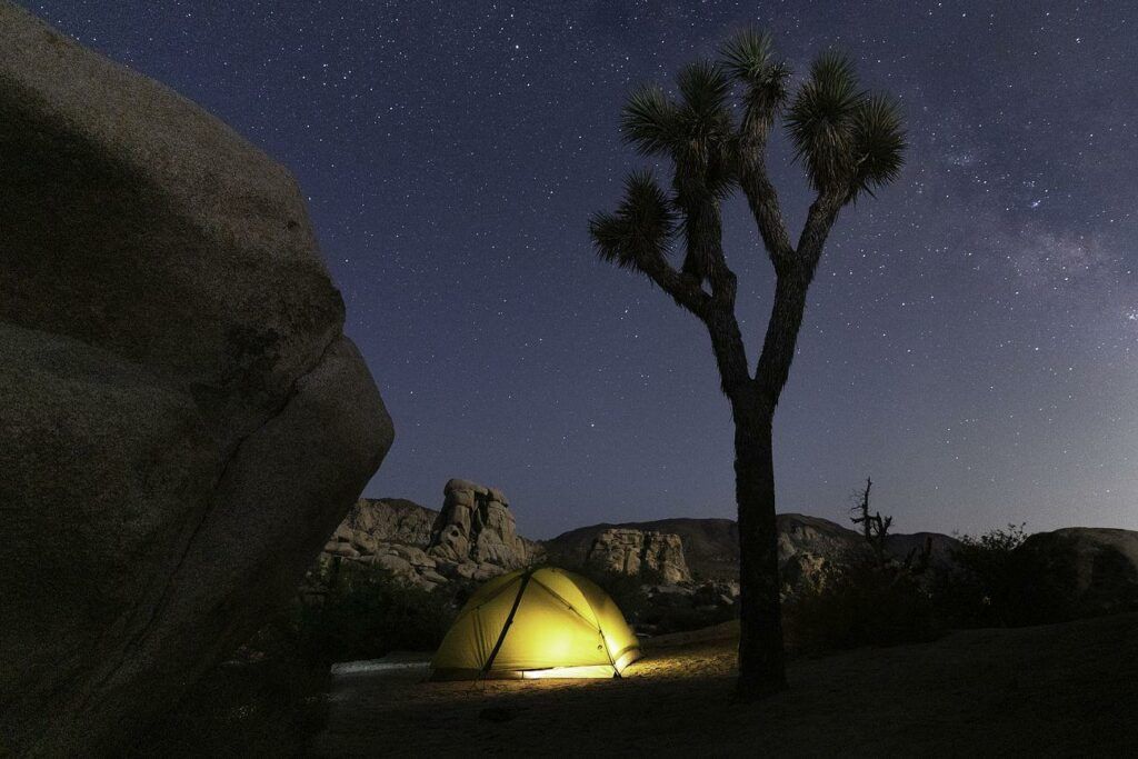 Glowing camping tent - a tent under a starry sky